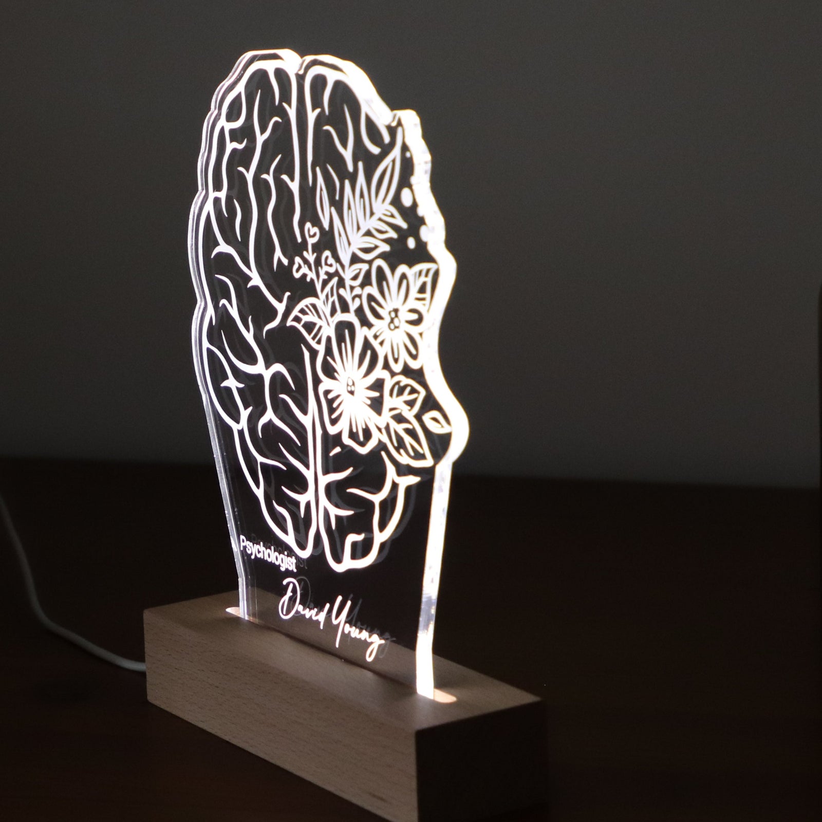 Personalized 3D illusion lamp featuring a brain anatomy design with floral accents, illuminated in a white tone, ideal as a unique gift for psychologists or mental health professionals