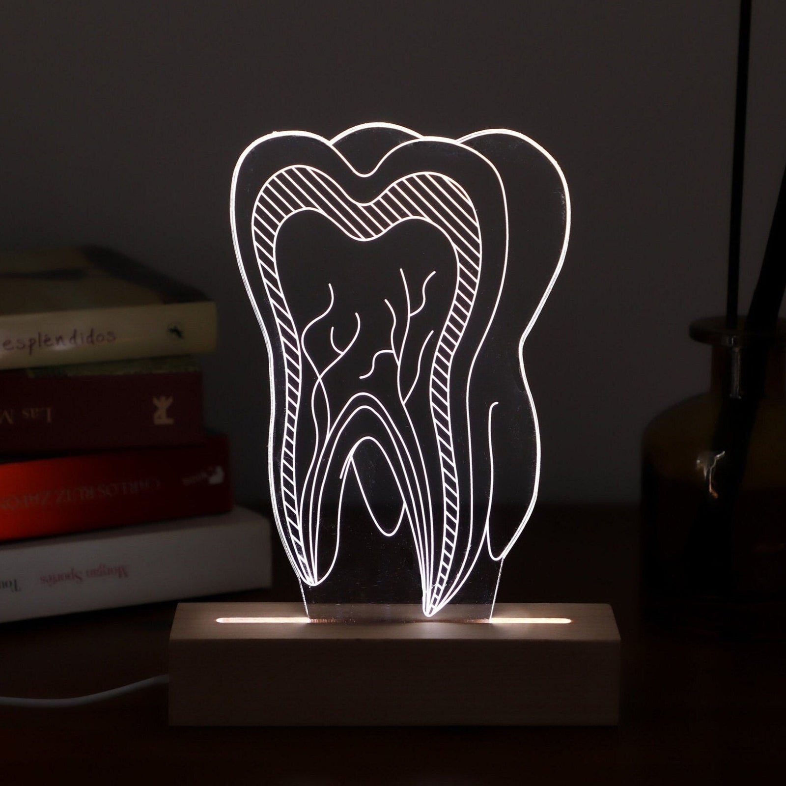 Unique 3D illusion lamp showcasing a glowing tooth design, a thoughtful gift for dentists or dental professionals