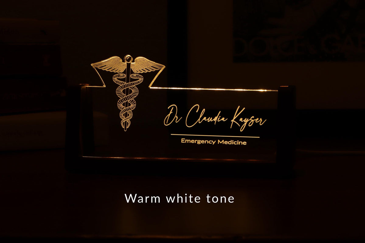 LED desk nameplate featuring a detailed Caduceus symbol design, illuminated in a warm white tone, perfect as a unique and thoughtful gift for doctors, healthcare professionals, or medical practitioners.