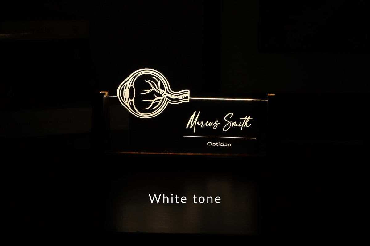 LED desk nameplate featuring a detailed human eye anatomy design, illuminated in a white tone, perfect as a unique and thoughtful gift for opticians, ophthalmologists, or eye care professionals.