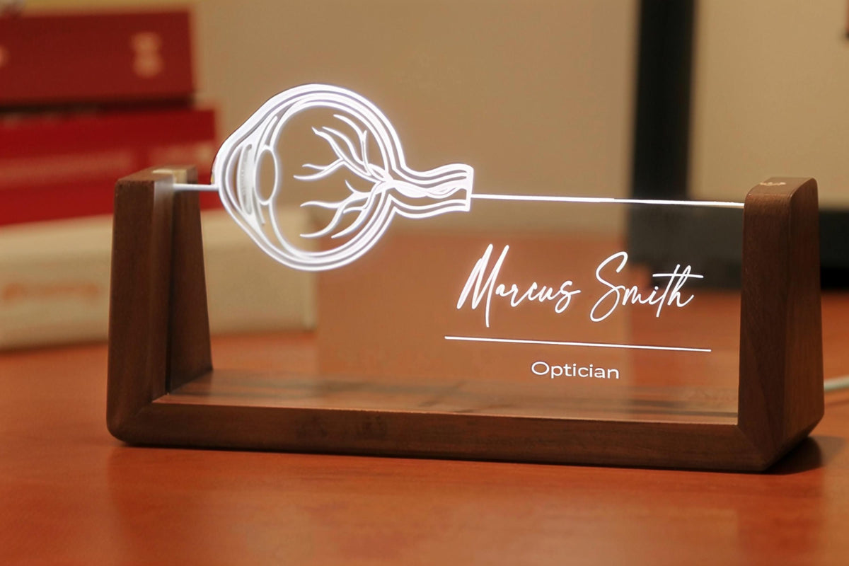 LED desk nameplate featuring a detailed human eye anatomy design, illuminated in a white tone, perfect as a unique and thoughtful gift for opticians, ophthalmologists, or eye care professionals.