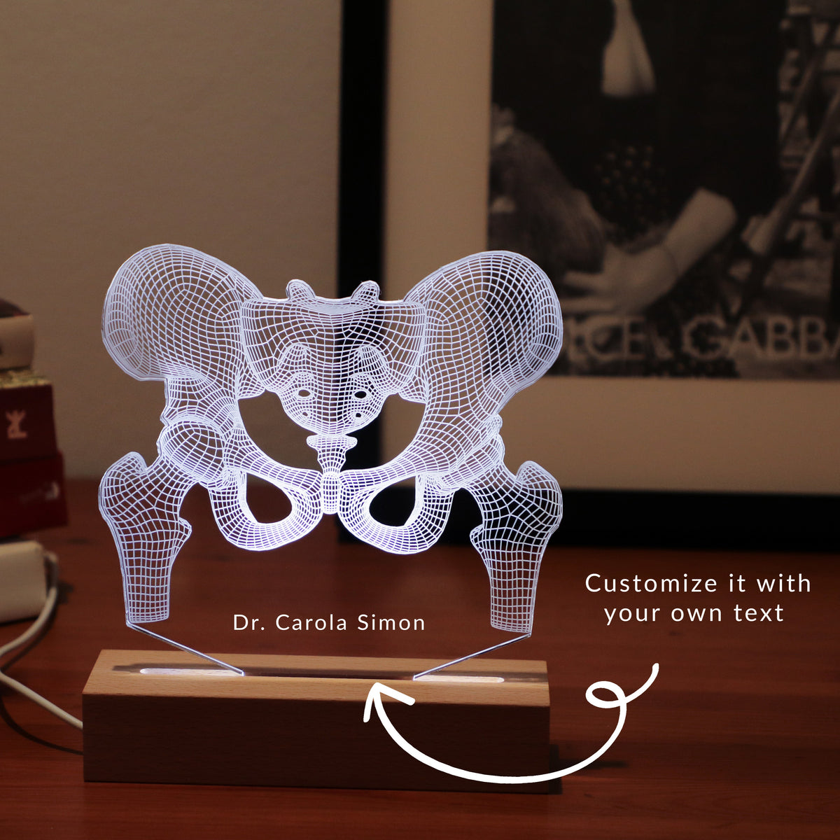 3D illusion lamp featuring a detailed human pelvic anatomy design, illuminated in a white tone, perfect as a unique gift for orthopedic specialists, physiotherapists, or medical professionals focusing on hip health.