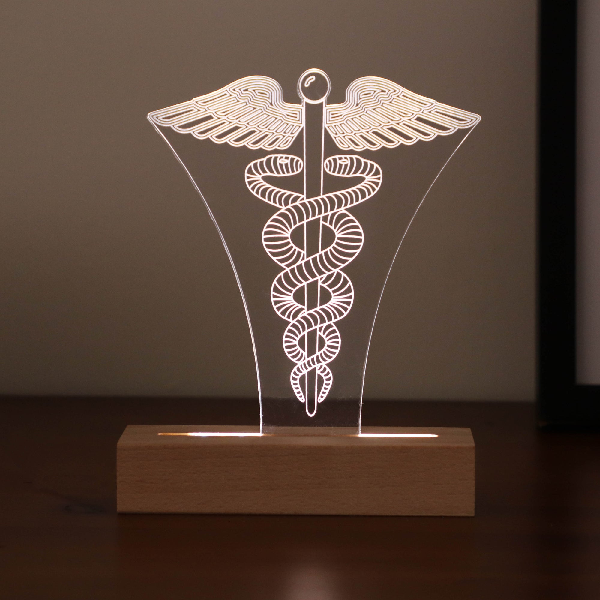 3D illusion lamp featuring the Caduceus symbol, illuminated in a white tone, perfect as a unique and thoughtful gift for doctors, healthcare professionals, or medical practitioners.