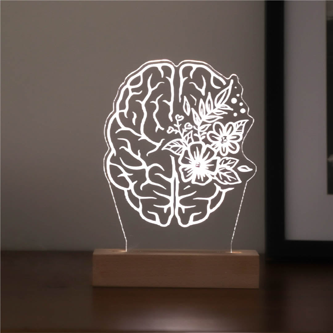 Personalized 3D illusion lamp featuring a brain anatomy design with floral accents, illuminated in a white tone, ideal as a unique gift for psychologists or mental health professionals
