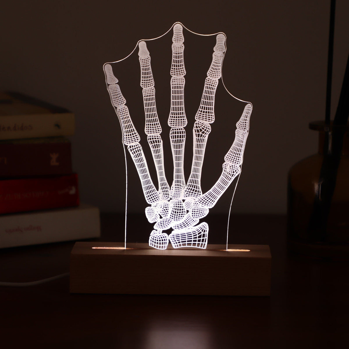 3D illusion lamp featuring a detailed human hand bone anatomy design, illuminated in a white tone, perfect as a unique and thoughtful gift for orthopedic specialists, physiotherapists, or medical professionals focusing on hand health.
