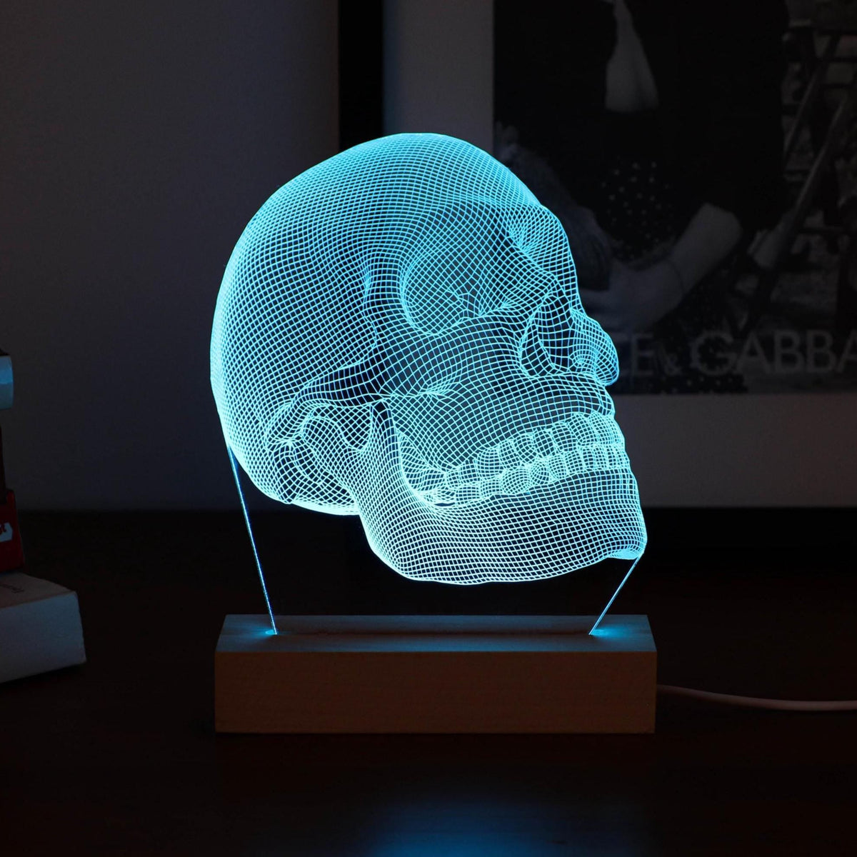 3D illusion lamp featuring a detailed human skull anatomy design, illuminated in a blue tone, perfect as a unique and thoughtful gift for medical professionals, anatomists, or educators.